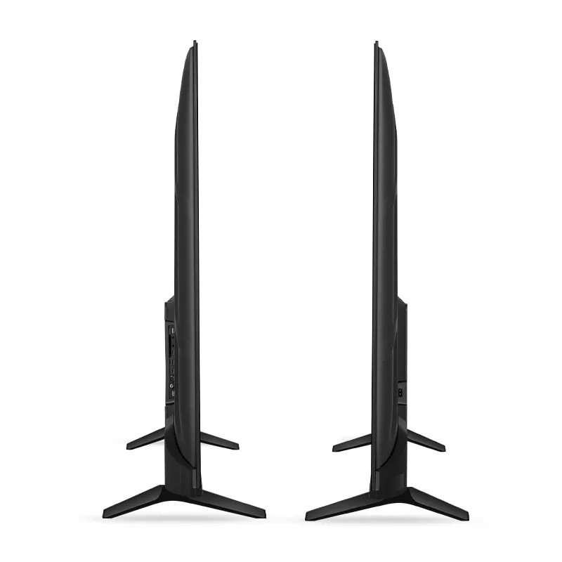 The television is supported by V-shaped plastic legs that are positioned widely apart, measuring 992 mm, providing stable support for the unit.