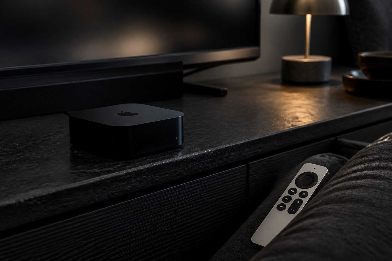 Apple TV 4K streaming box beside a Siri Remote