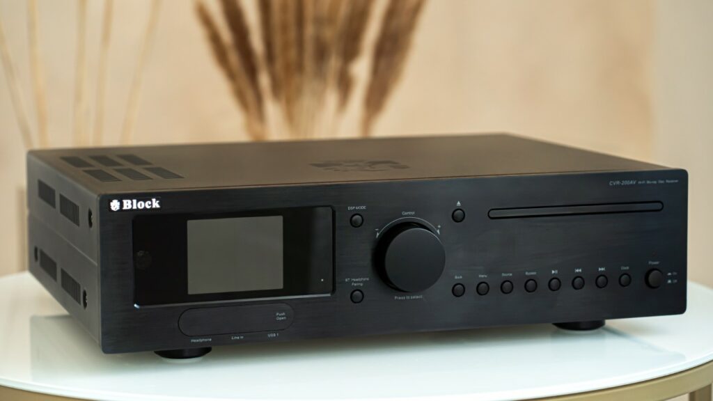 Best AV Receivers Compared: Denon, Arcam, Block and Marantz 10 AV receiver connected to a TV, speakers, subwoofer, and HDMI home cinema sources