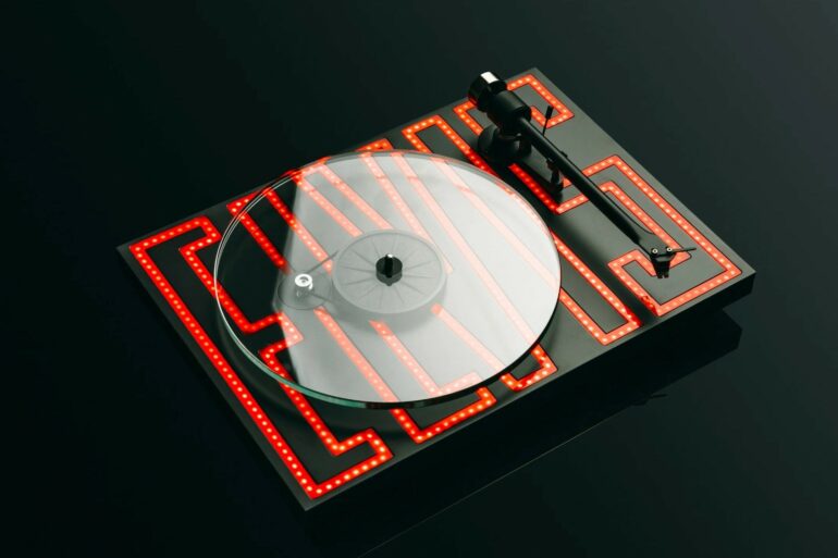 Pro-Ject Audio Launches Elvis Presley Turntable with LED Design and Sumiko Cartridge 16 Turntable tonearm and cartridge being carefully set up for better vinyl playback