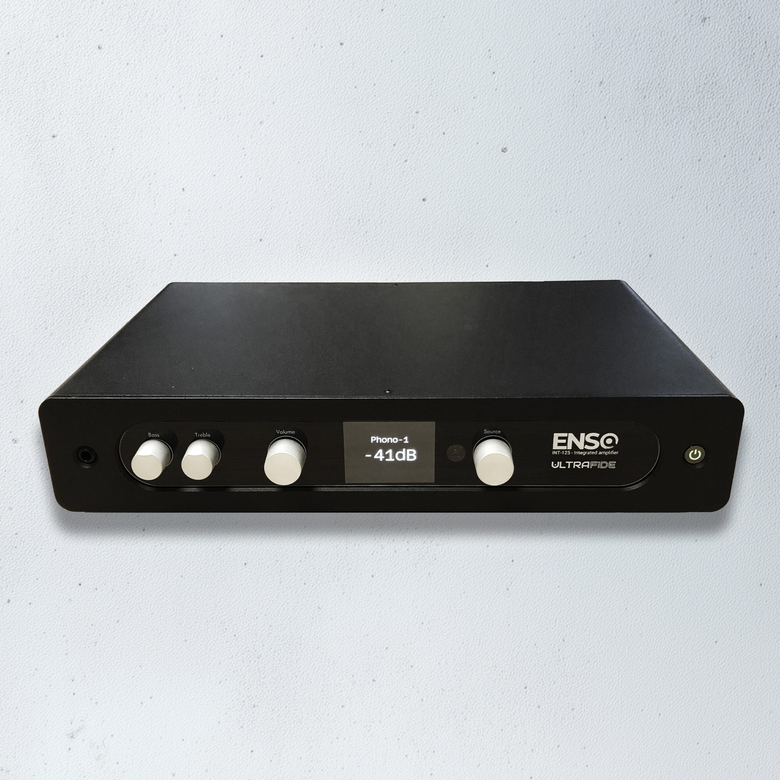 The Ultrafide ENSO INT-125 features a minimalist 17-inch chassis with a central OLED display, precision volume control, and internal UltraSigma output stage delivering 2 × 125 watts into 8 ohms from a linear toroidal power supply.