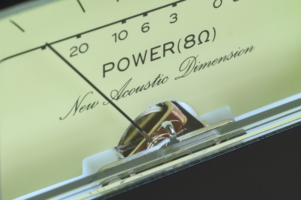 Classic walnut cabinet and glowing VU meters bring true vintage character to a modern system