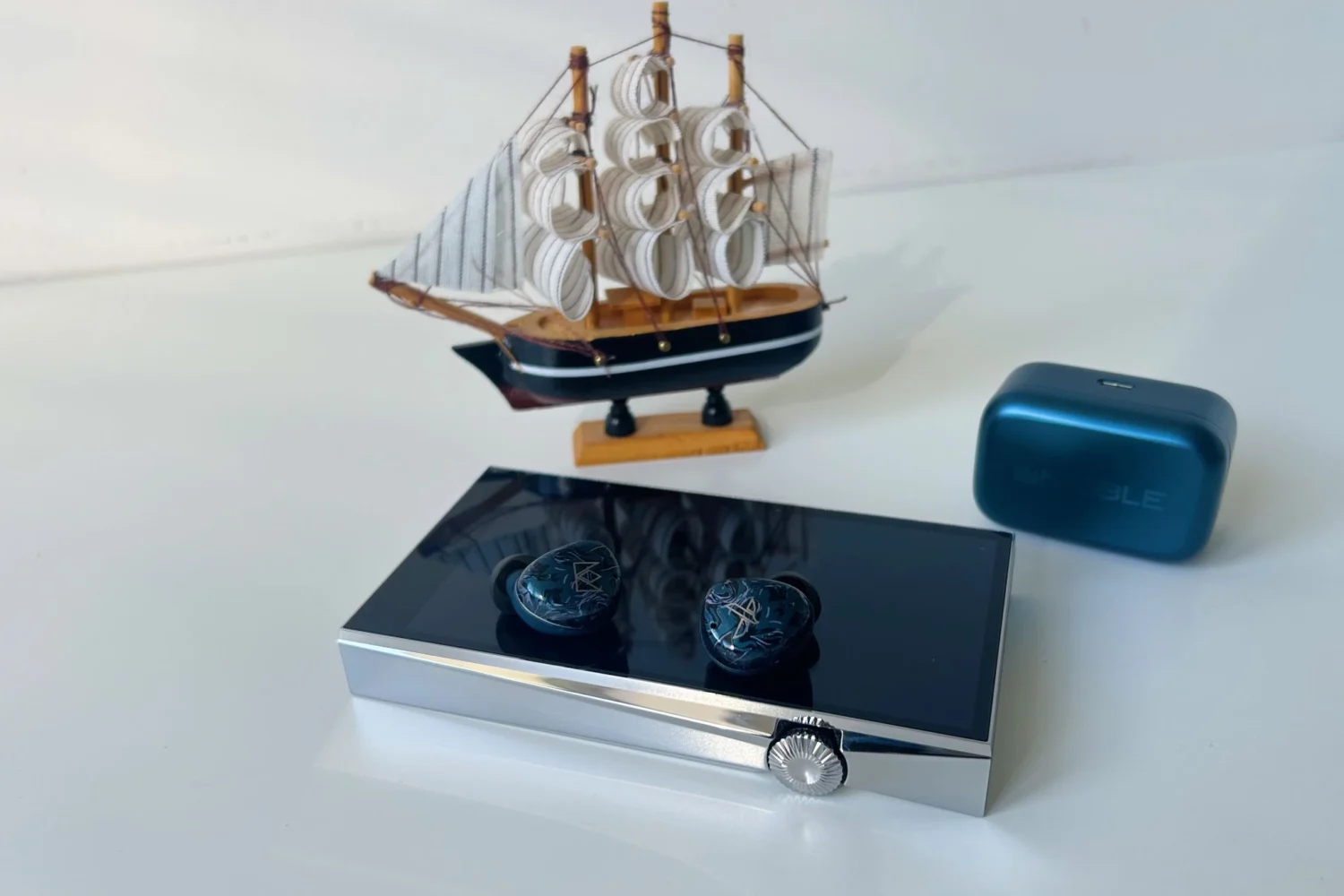 Noble Audio Osprey Review: Boutique Ambition in an Accessible TWS 3 Noble Audio Osprey blue true wireless earbuds with patterned acrylic faceplates and charging case