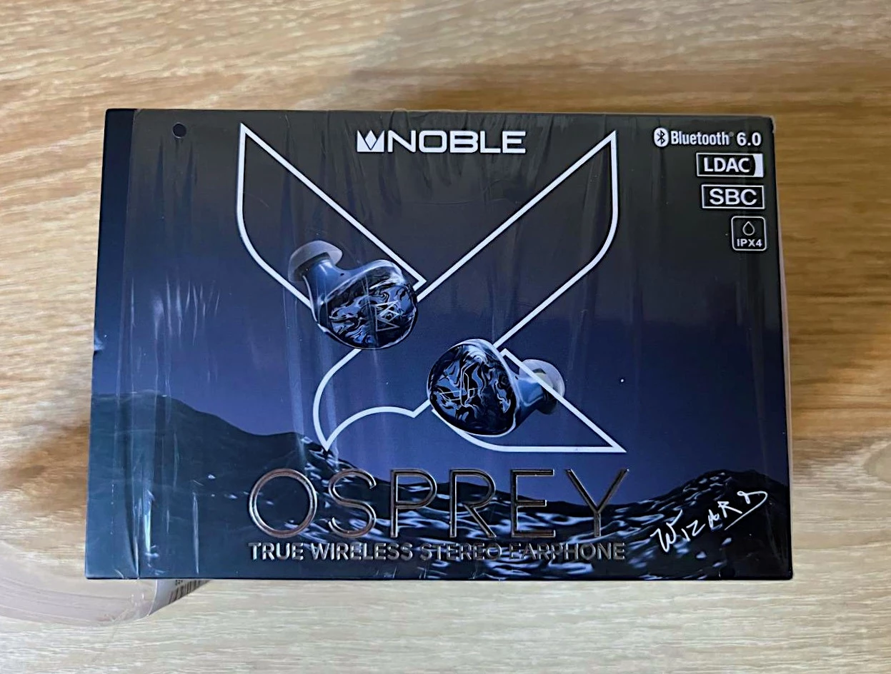 Noble Audio Osprey Review: Boutique Ambition in an Accessible TWS 4 Noble Audio Osprey blue true wireless earbuds with patterned acrylic faceplates and charging case