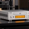 FiiO’s compact DP11 CD player can operate with an amplifier or external DAC while also offering USB connectivity and direct WAV ripping.