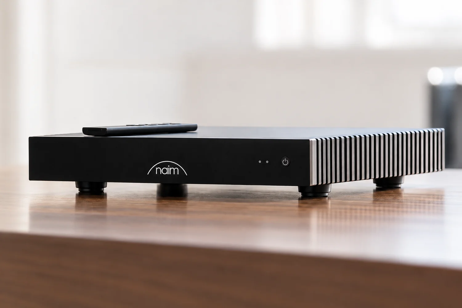 Four fitted feet and an IR remote transform Naim’s rack-focused streaming amplifier into a more practical option for shelves and living-room furniture.