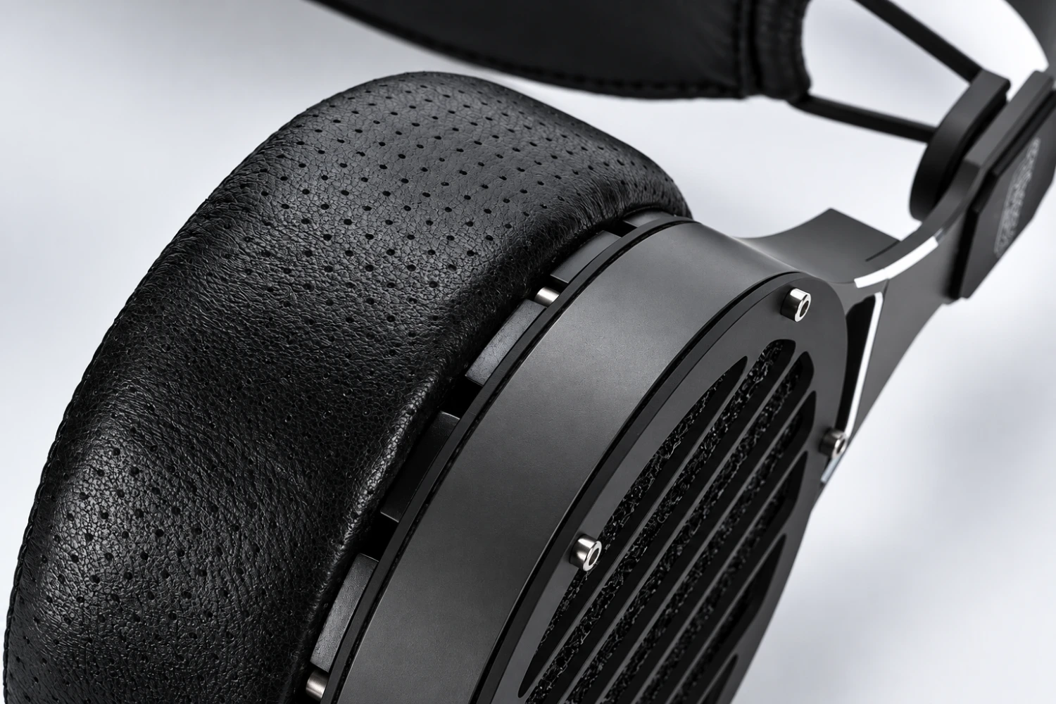 Eight costly headphones reveal how dynamic, planar magnetic and electrostatic designs turned personal listening into a serious high-end discipline.