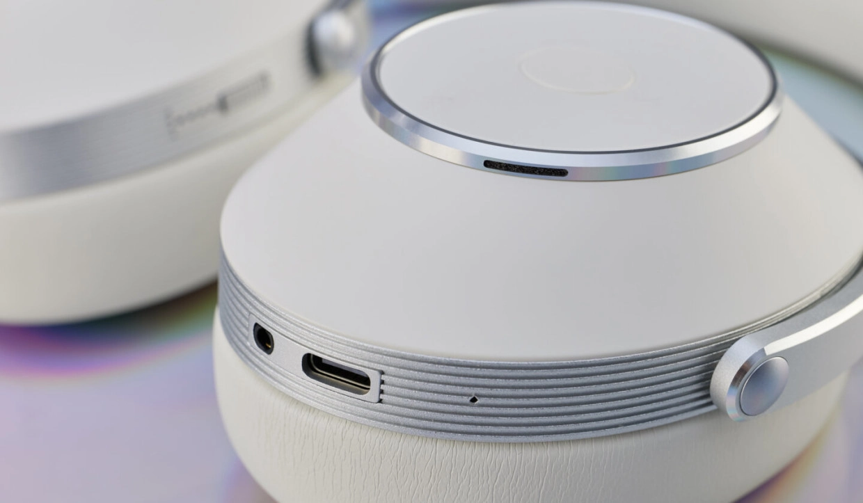 T+A Solitaire T Pro Is Built for More Than Bluetooth 24 White earcup close-up with silver trim, USB-C port and analog socket