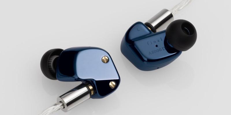 Final Reworks Its Flagship-Style A8000 DC Around Magnesium 22 Two glossy blue in-ear monitors arranged with clear braided cables on white