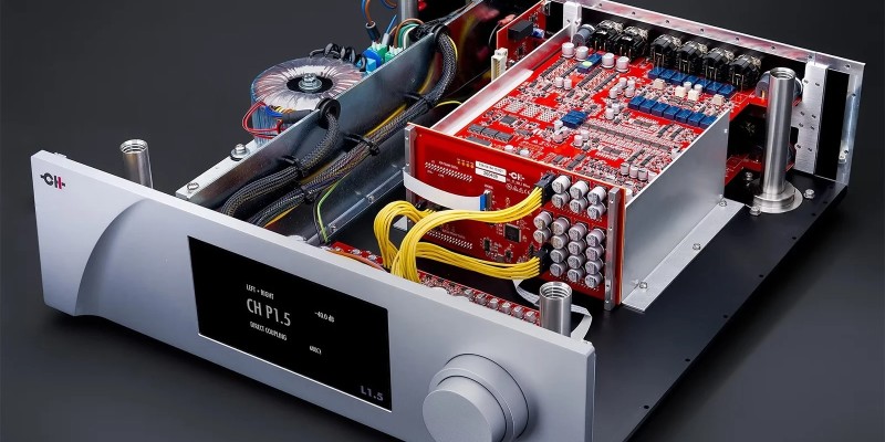 Inside CH Precision’s P1.5 and L1.5 Preamp Redesigns 22 Angled interior view showing stacked red circuit boards, yellow wiring, transformer and machined silver front panel